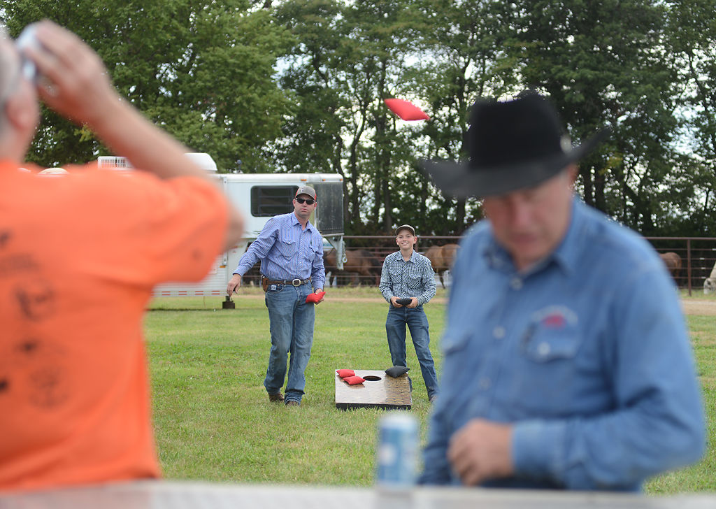 The crew from the Three Hills Rodeo Company takes a break from prepping